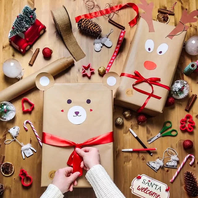 Kraft wrapped gifts turned into cute bear and reindeer faces with red bows