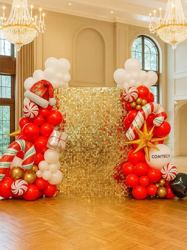 Gold shimmer wall photo backdrop with sparkling holiday decor