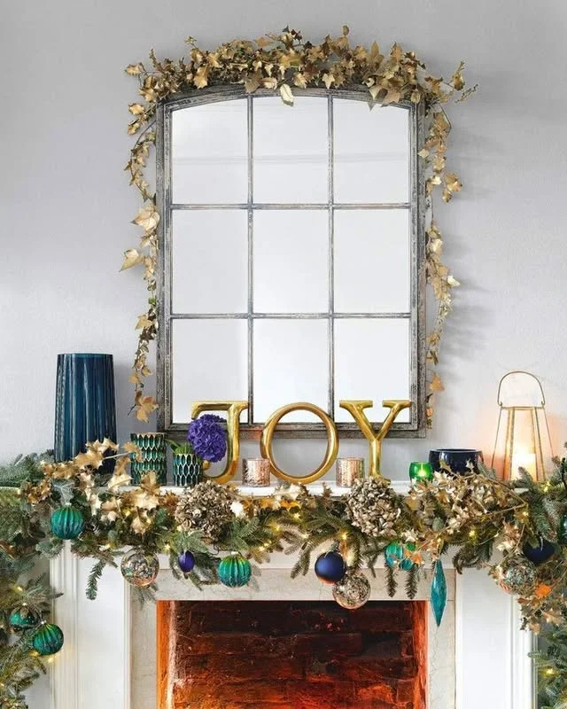 Maximalist Christmas mirror decorated with garland and ornaments