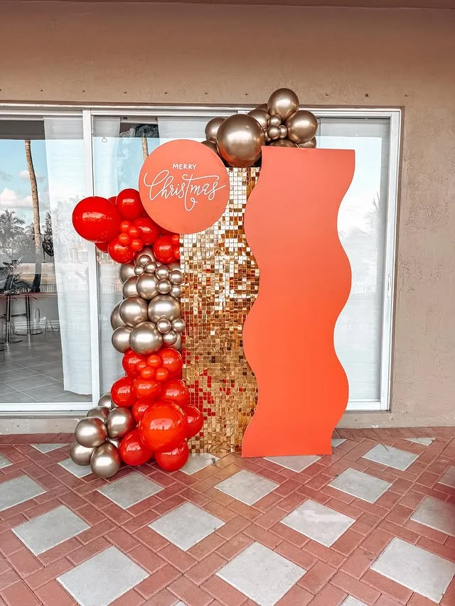 Christmas photo backdrop with red and silver balloons