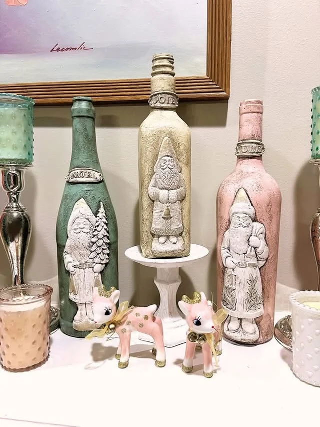 Hand painted Christmas bottles with Santa designs in pink, green and cream