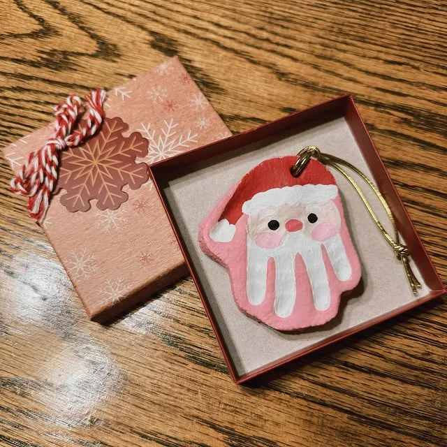 Handprint Santa keepsake ornament in a gift box
