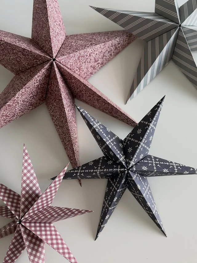 Folded paper stars made from patterned wrapping paper