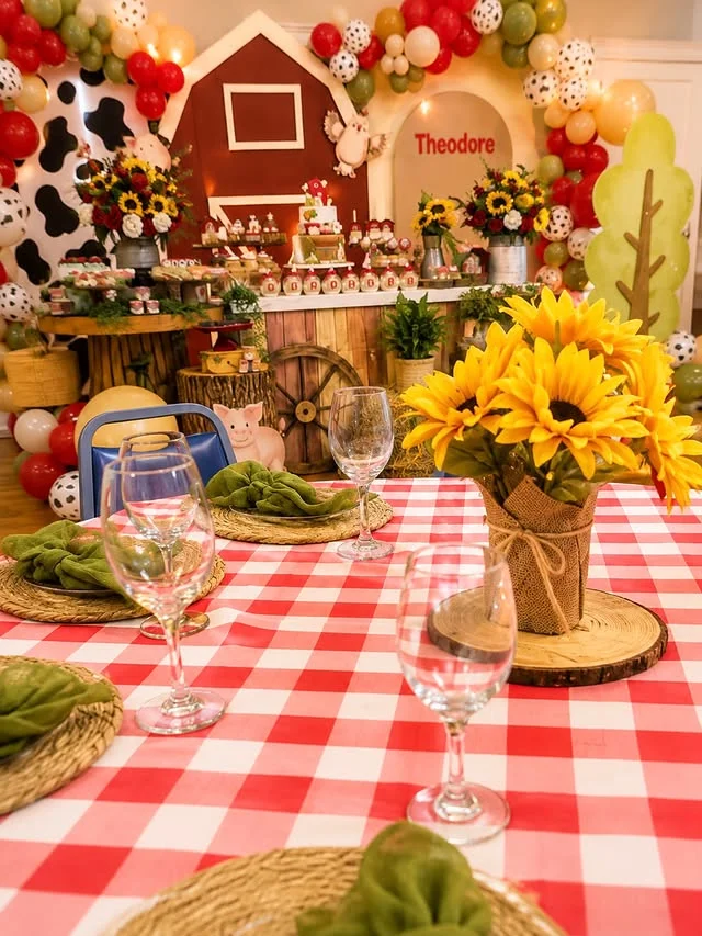 Farm birthday table with checkered cloth and sunflower centerpiece