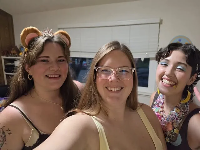 Guests wearing fuzzy monkey ear headbands at a party