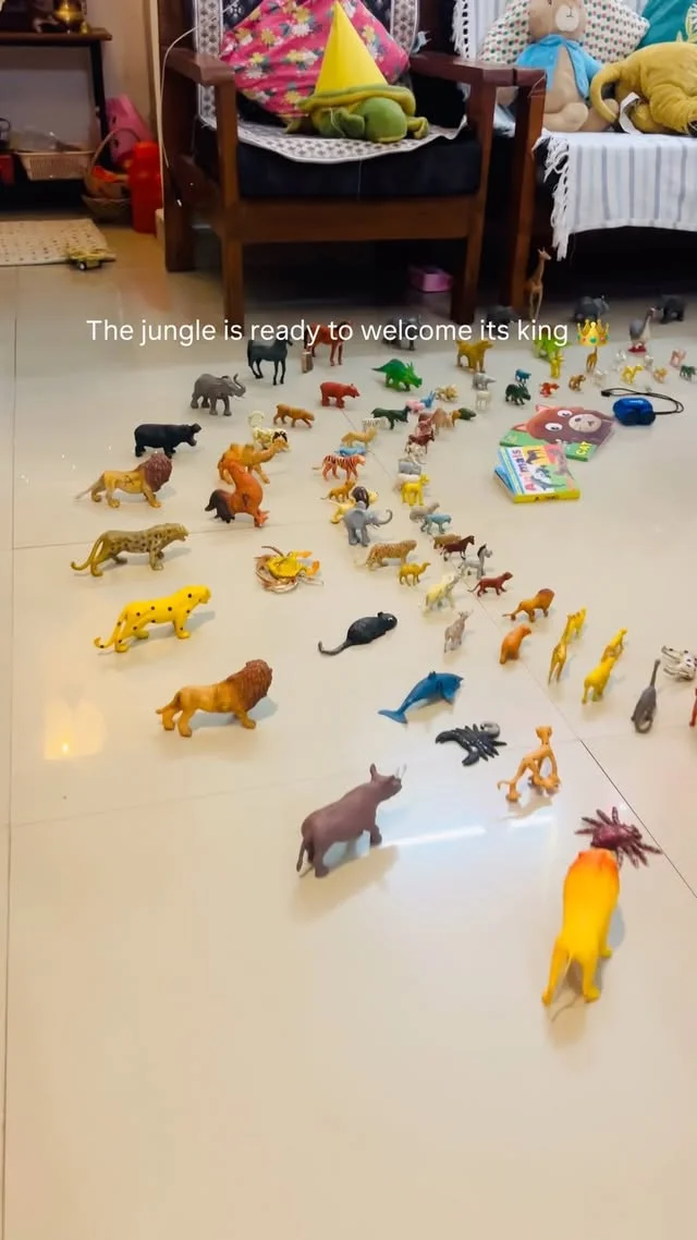 Toy jungle animals arranged on a party table