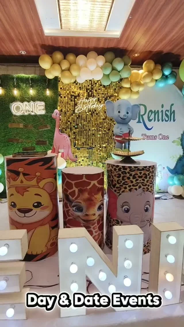 Golden jungle stage with glowing ONE letters and animal cylinders